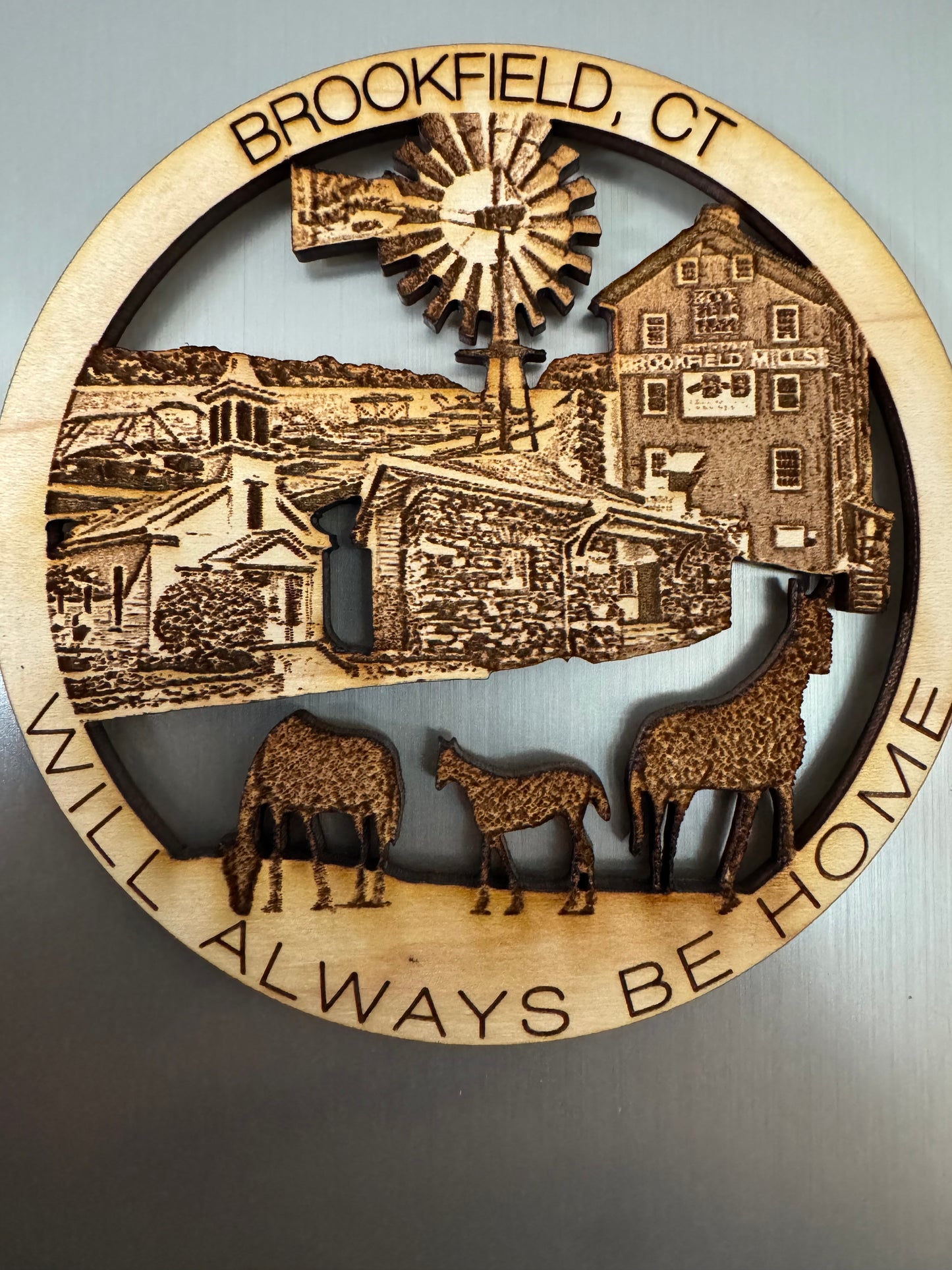 Brookfield, CT refrigerator magnet featuring Brookfield Mills, a windmill, historic buildings, and grazing animals.