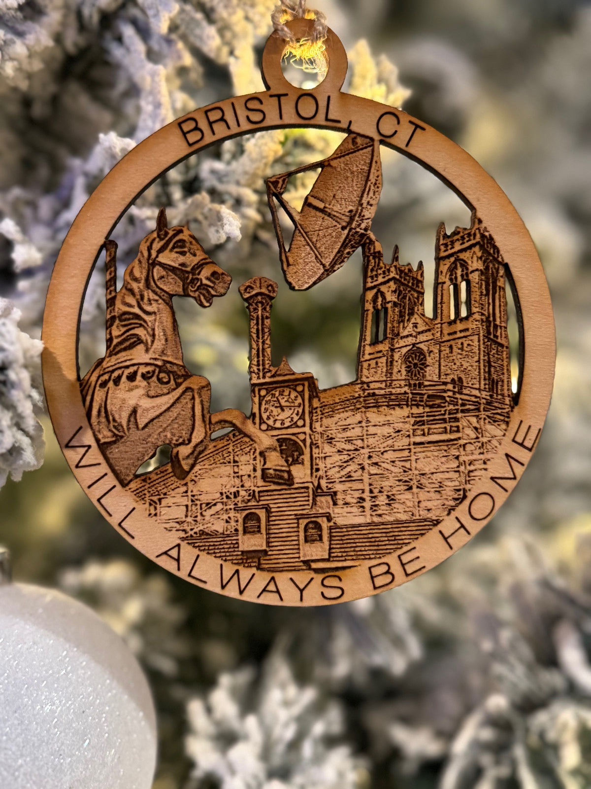 Bristol, CT Christmas ornament featuring a lake compounce carousel horse, espn dish, St. Joseph's church, clock tower