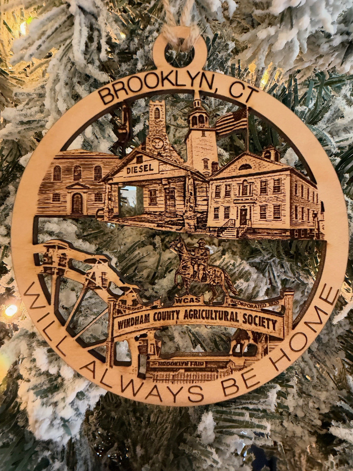 Brooklyn, CT ornament features Brooklyn Fair Grounds entrance sign, Town Hall and flag pole, Old Trinity Church and new, The old service station on route 169..