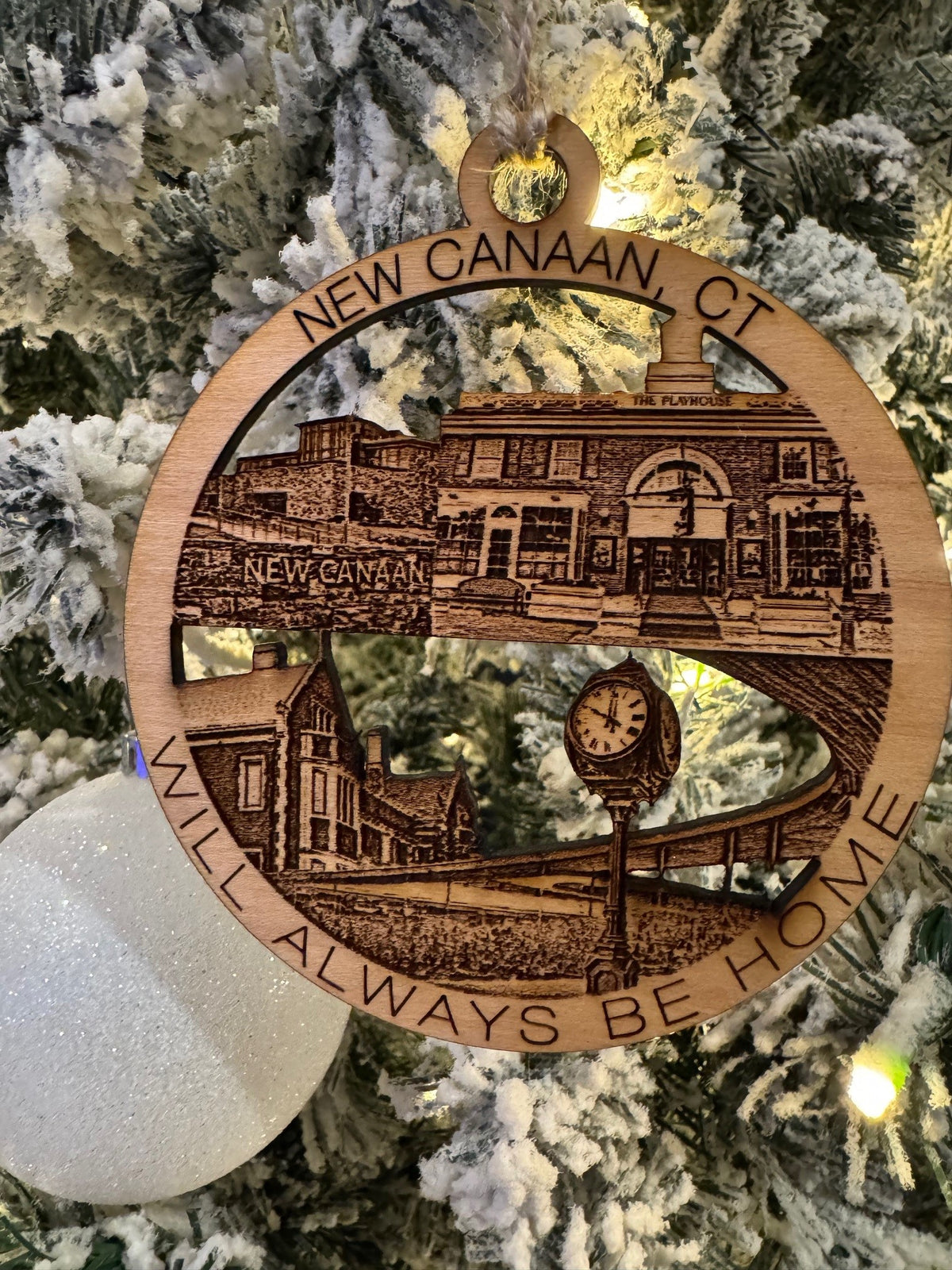 New Canaan, CT Christmas ornament featuring the Playhouse, a street clock, and local architecture.
