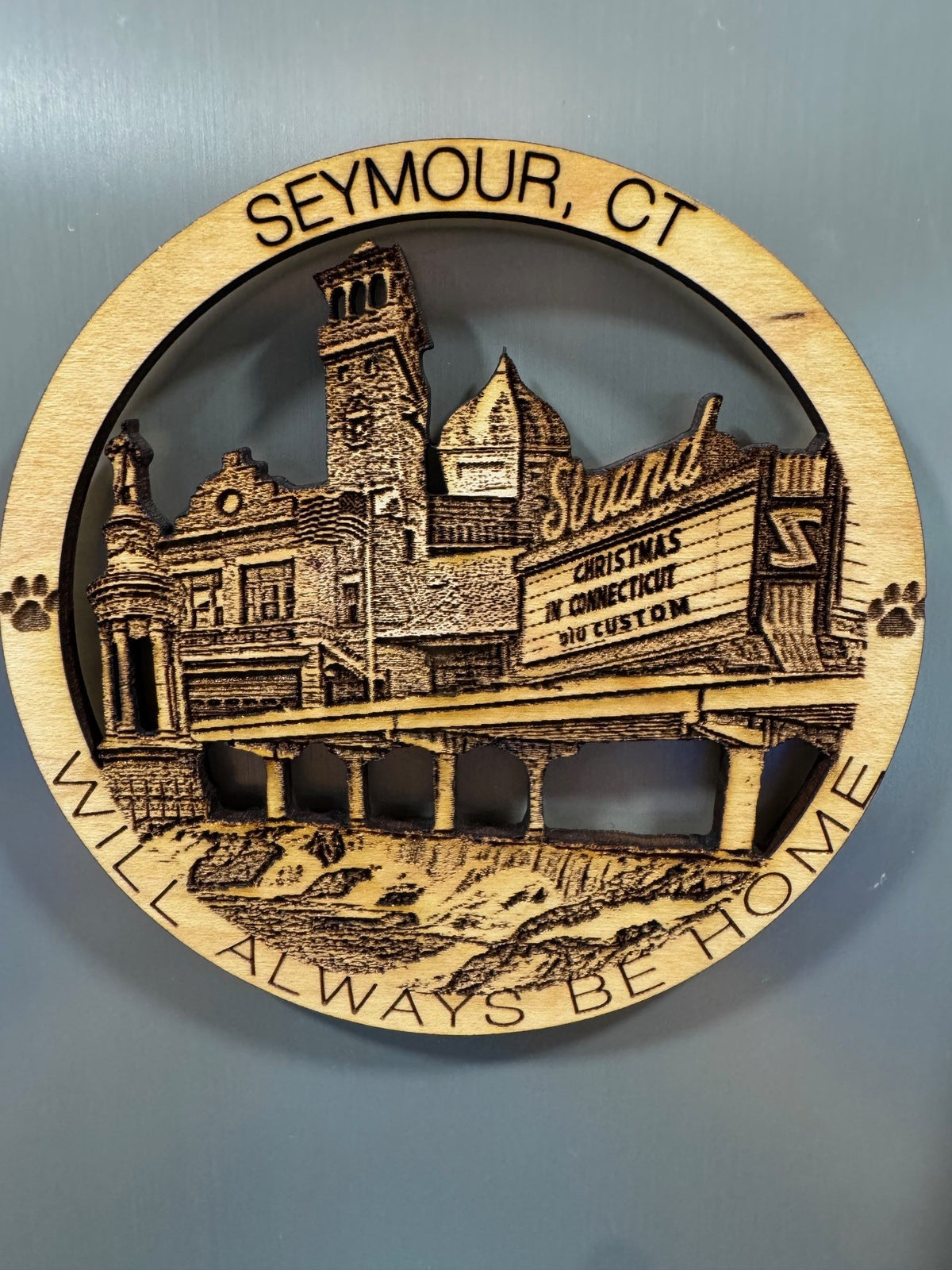 Seymour, CT refrigerator magnet featuring the Strand theater, historic buildings, a bridge, and waterfall.