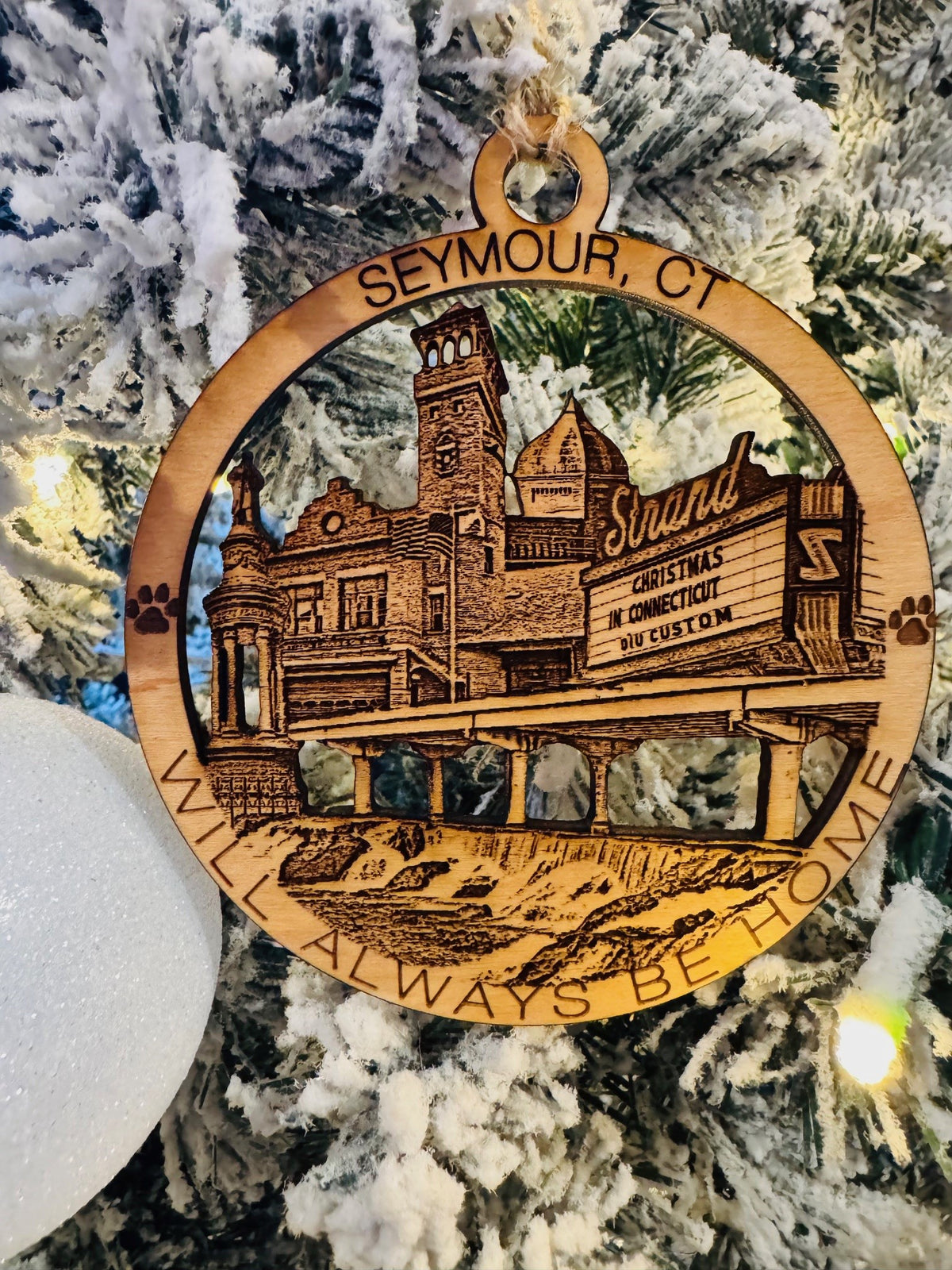Seymour, CT Christmas ornament featuring the Strand theater, historic buildings, a bridge, and waterfall.