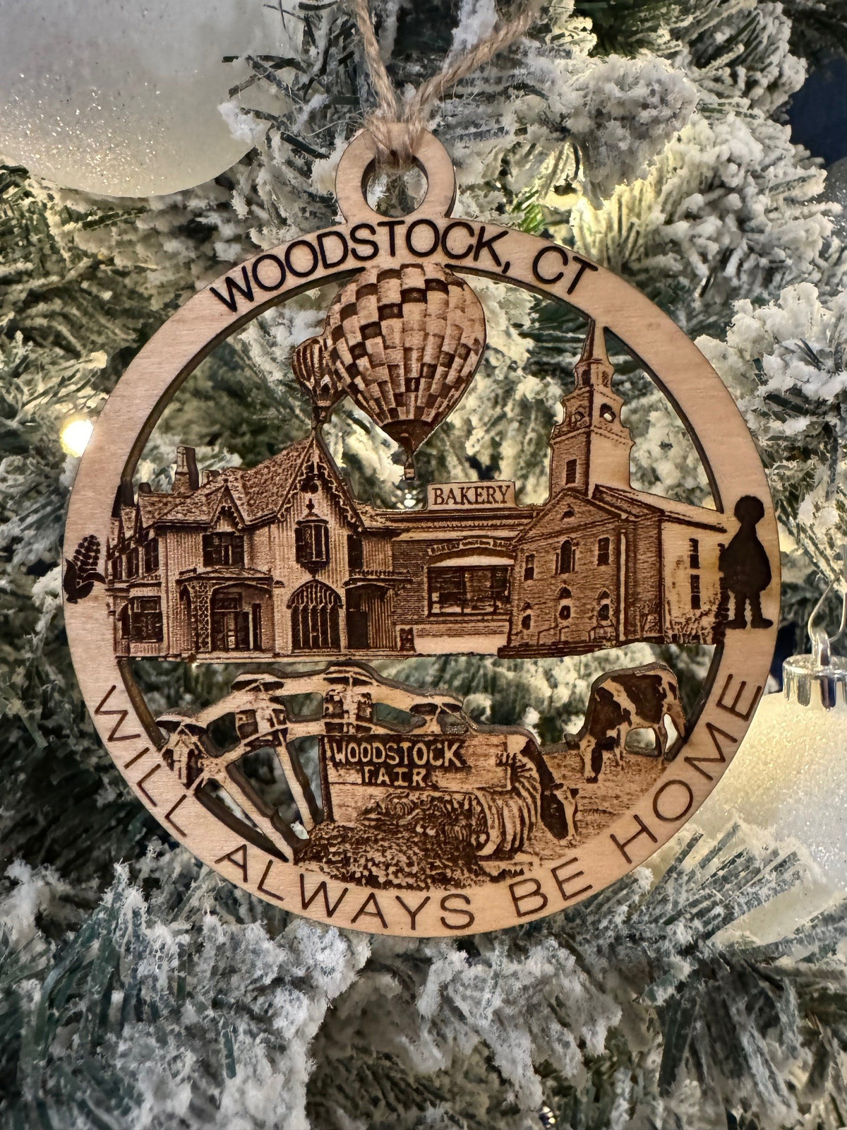 Woodstock, CT Always Home ornament hanging on a Christmas tree